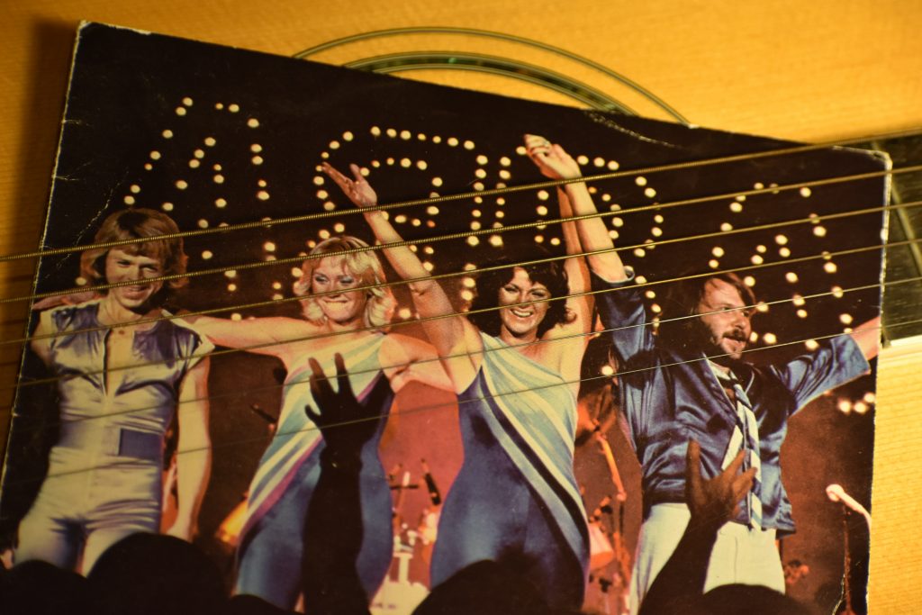 ABBA album behind guitar strings. -- wedding music