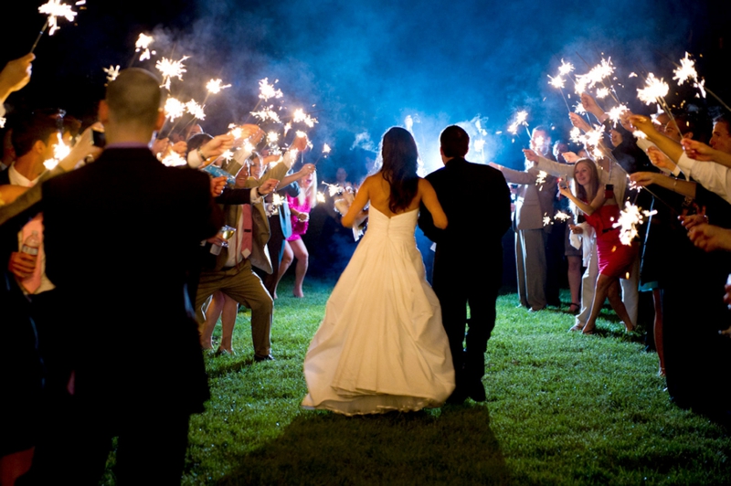 couple walking through sparklers