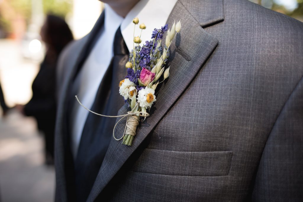 Close up of best man with boutonniere.