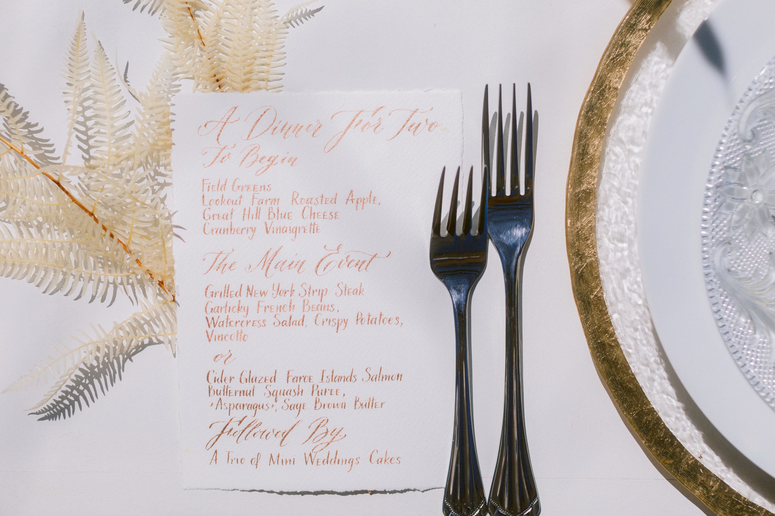 A gold script micro-wedding menu