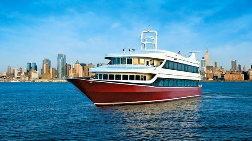 yacht on Hudson river with Manhattan skyline in the background