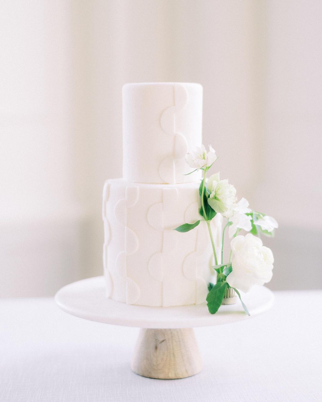 a two-tier white wedding cake