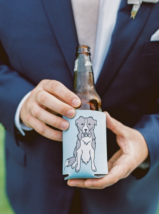 A beer koozie with a dog on it